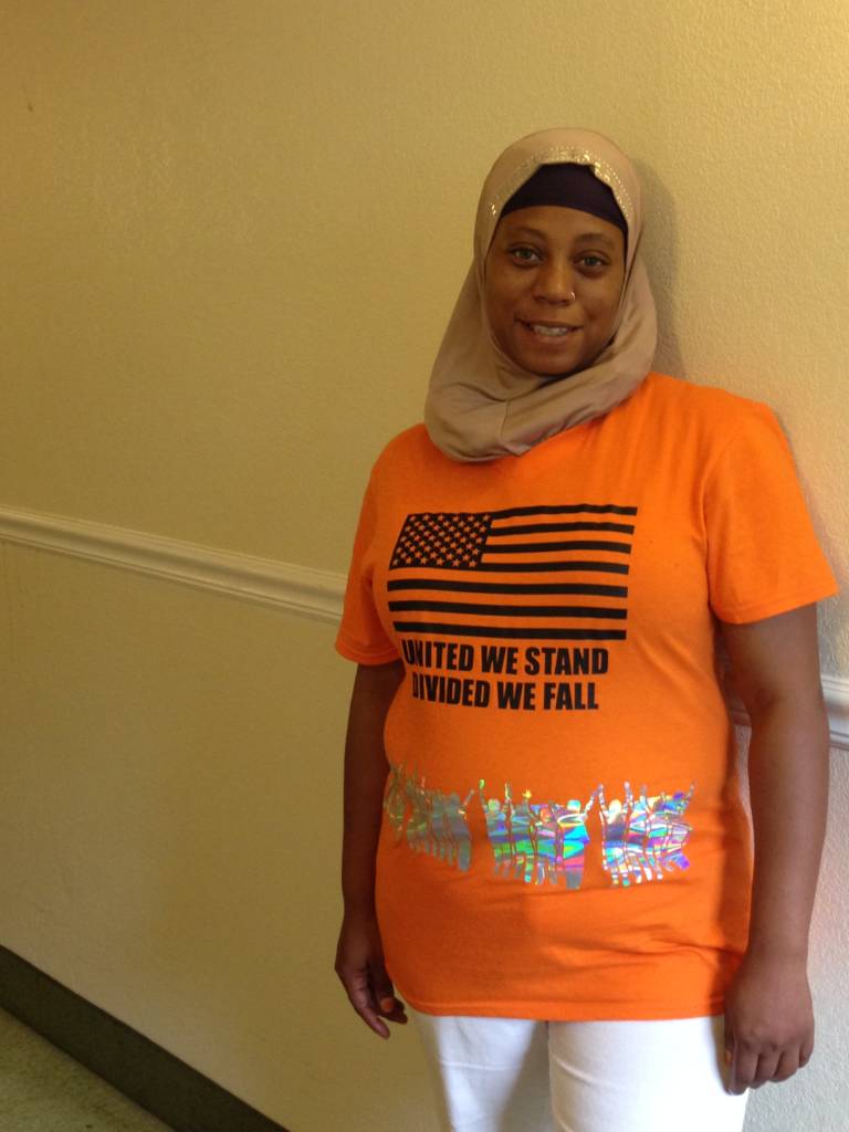 a photo of Naila Goodwin wearing the Code Orange t-shirt
