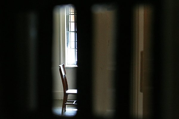 Chair behind bars