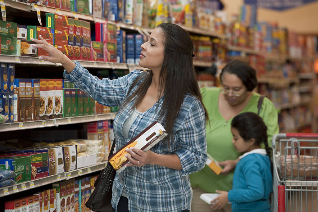 Customers shop for items in grocery