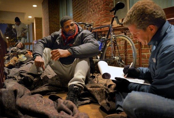 Man sits on floor