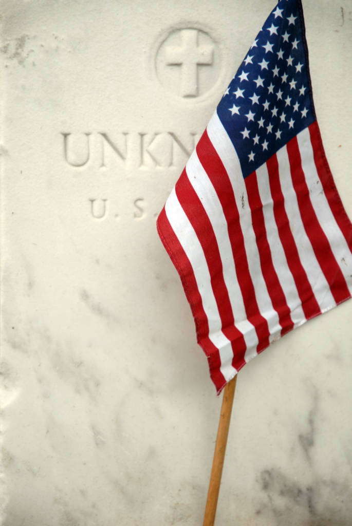 flag in front of tombstone