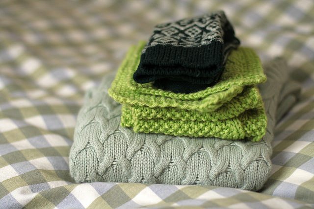 stack of scarves and gloves