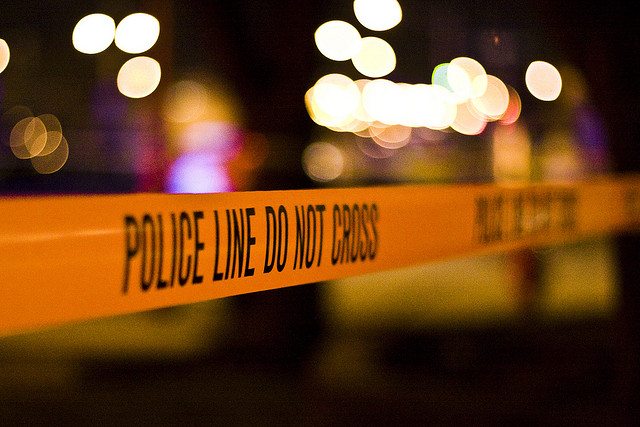 Image of yellow police tape.