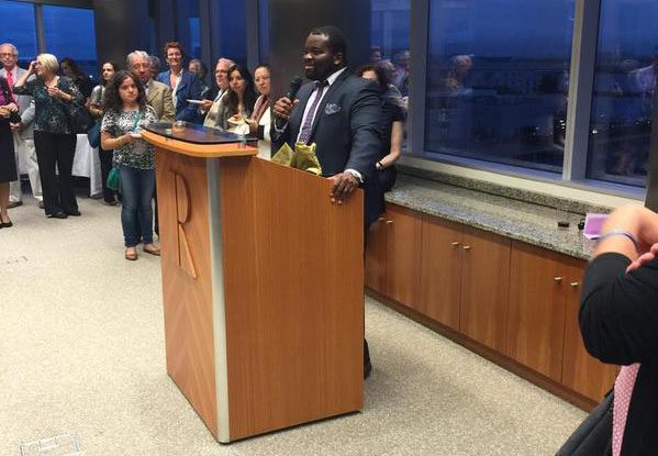 Photo of a speaker of the Open Arms Housing gala.