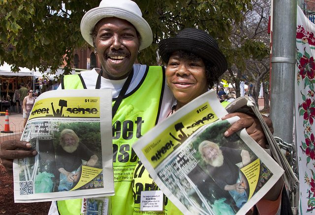Image of vendor Carl Turner and his sister Deborah Turner selling Street Sense at Eastern Market.