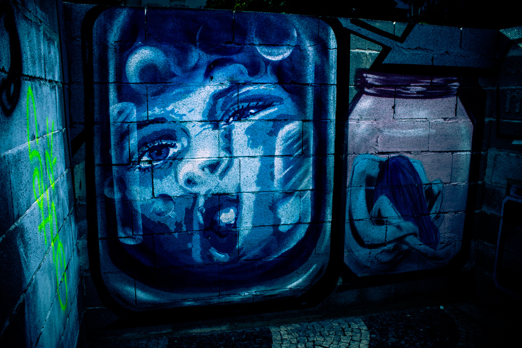 Photo of murals depicting human trafficking.