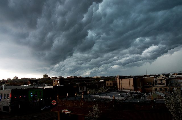 Image of a city covered in stormy clouds.