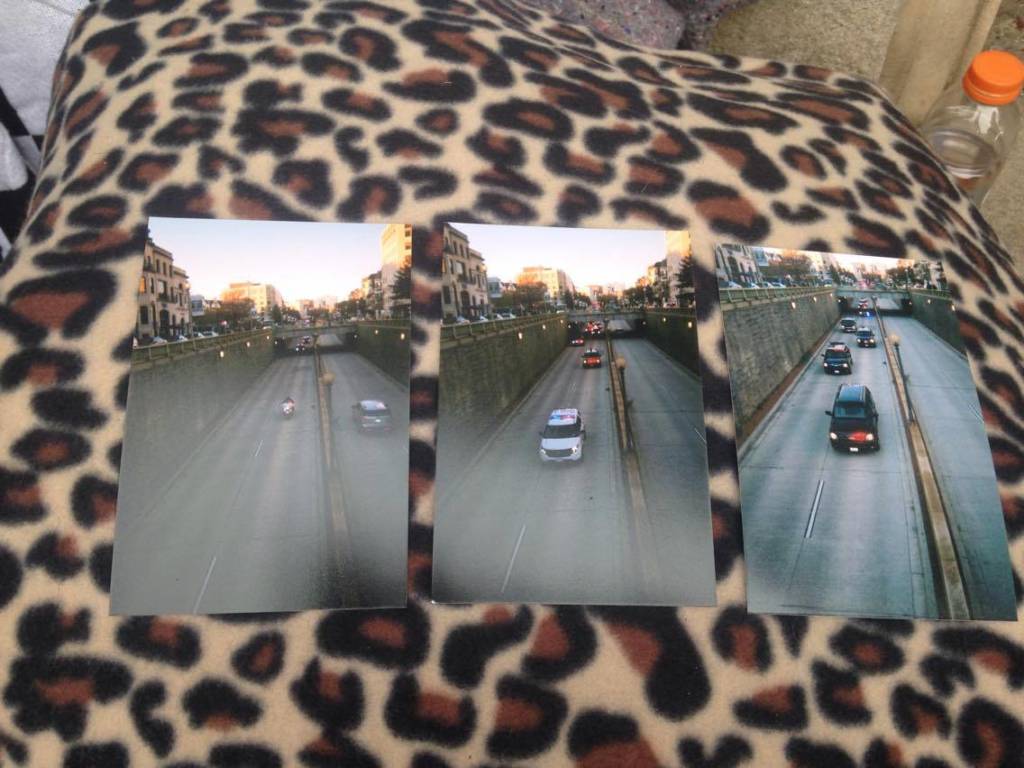 Photo of photographs of the Dupont Circle underpass taken by a man participating in the new photography project, "District Displaced"