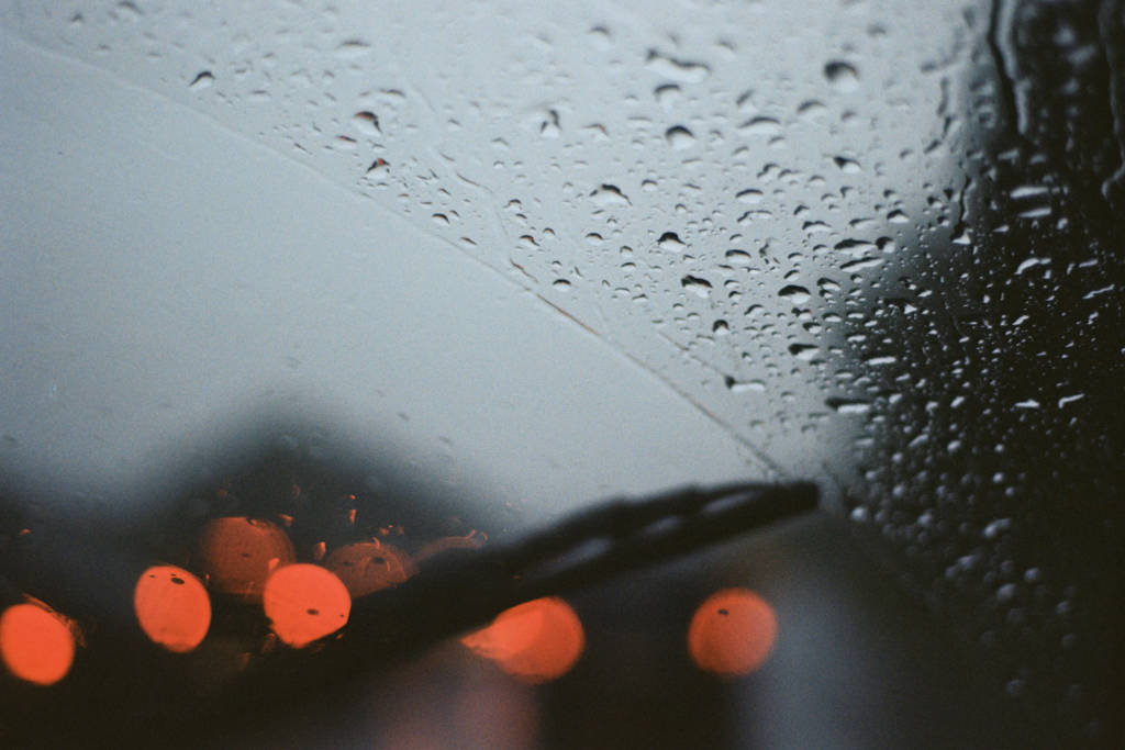 Rain seen through a car window.