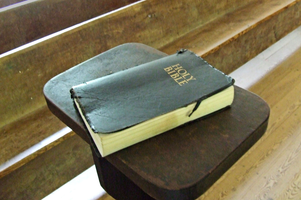 A Bible sitting on a desk