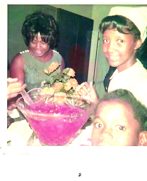 A photo of a woman and two children.