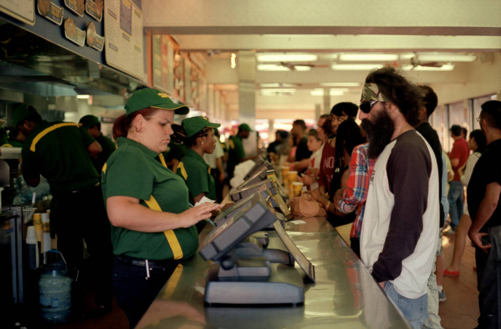 A photo of a cashier at a fast food restaurant