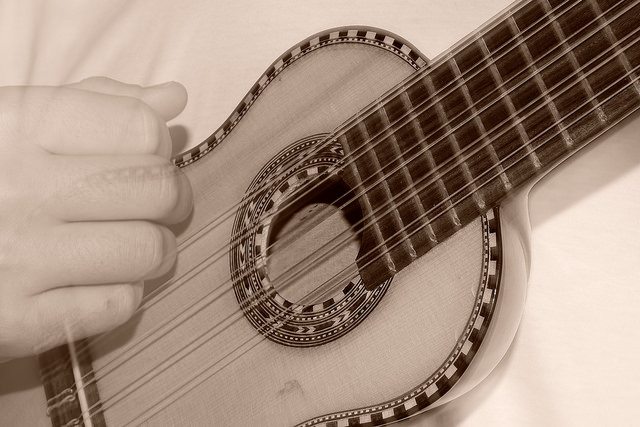 A man playing the charango.