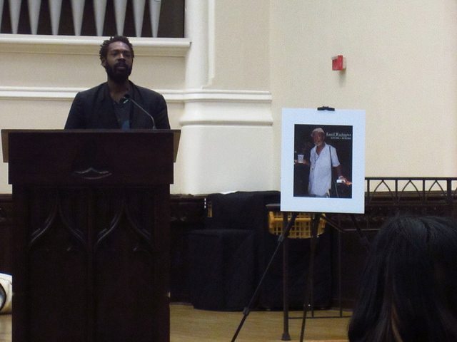 Reginald Black honoring Kanell at a memorial service in the Church of the Epiphany