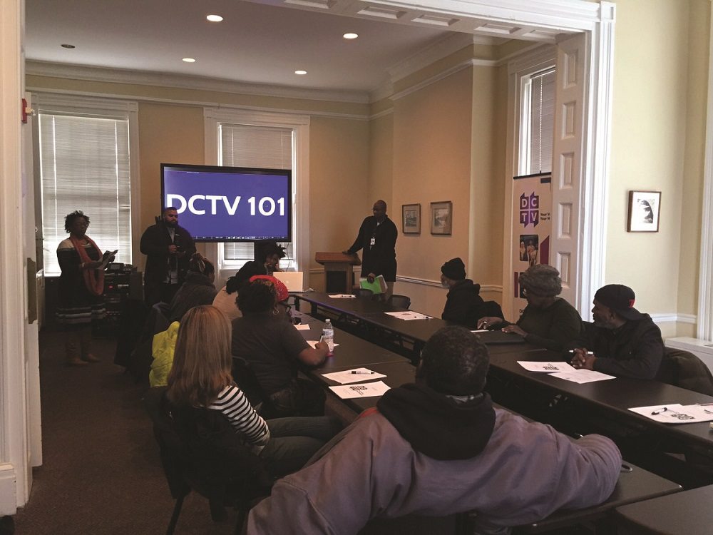 Street Sense filmmakers sit in a DCTV classroom