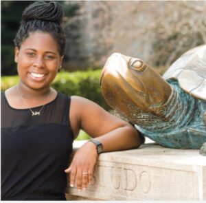 A portrait photograph of Ashley Clarke