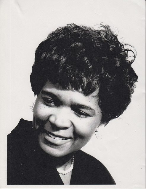 a black and white photo of a young Babbara Pollard from the neck up