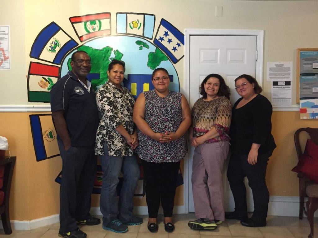 A photo of five staff members from D.C. Doors