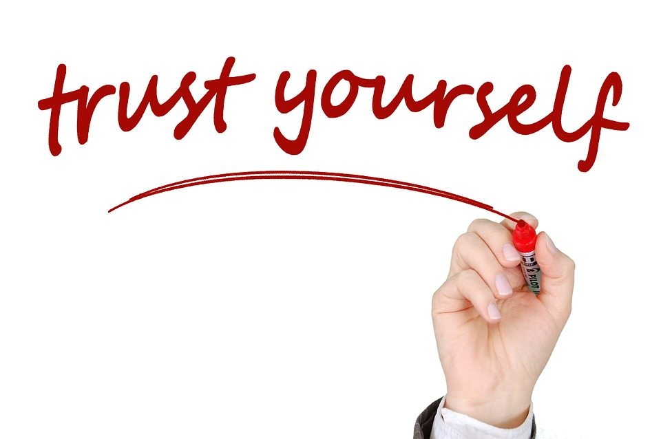 a photo of someone writing "trust yourself."
