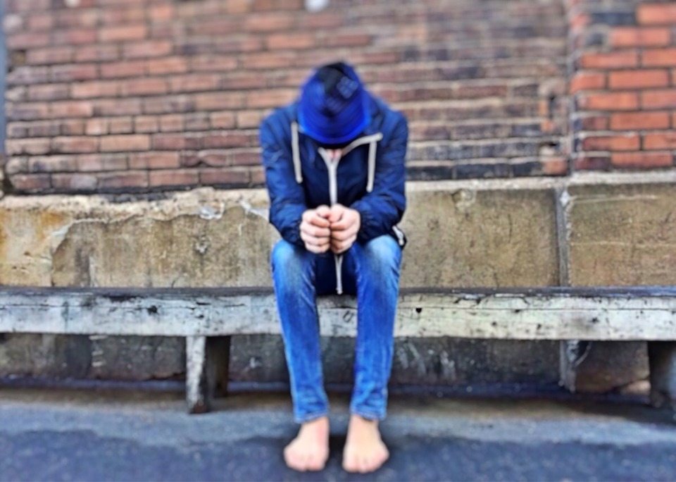 A photo of a person sitting down.