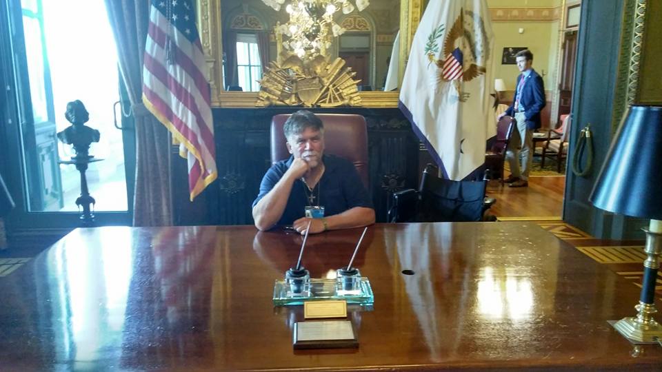 A photo of Dennis Schulze in the oval office at the White House.