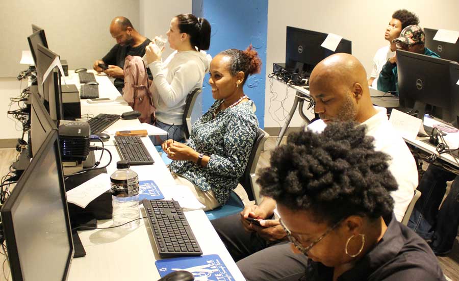 Several rows of students at computers in the new Byte Back lab.
