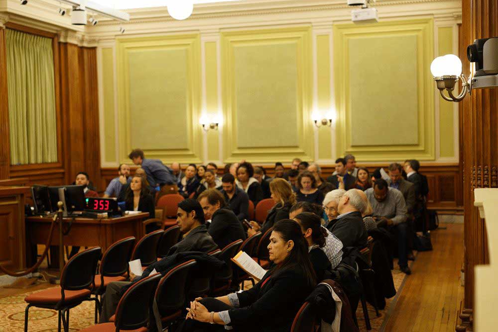 A full audience in the city council chamber.