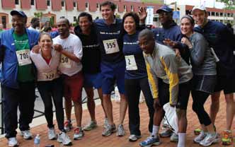 Back on My Feet’s Tyrone Duncan in grey and yellow shirt with some other members who just finished the race.