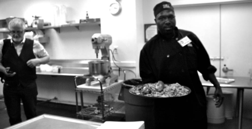 A student at DC Central Kitchen, which trains ex-offenders and victims of substance abuse in culinary skills, presents his final exam.