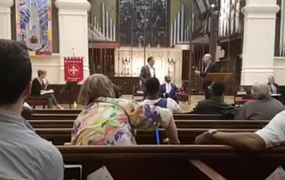 Patty Mullahy Fugere, of the Washington Legal Clinic for the homeless (left), moderated the forum within the sanctuary of the Church of the Epiphany.