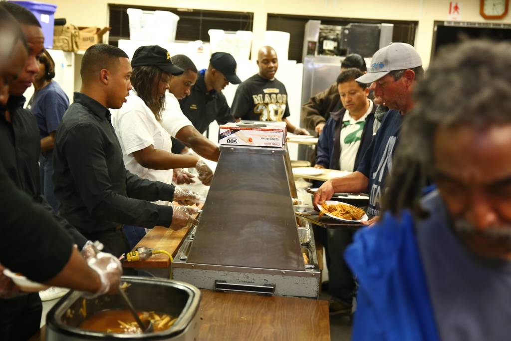 Servicemembers from Camp Pendleton and local volunteers serve food at the Bread of Life Rescue Mission in Oceanside, Calif., Jan. 28. Nine Marines and one sailor, with the help of several community volunteers, prepared and served a free dinner for local homeless and others in need at the Mission.