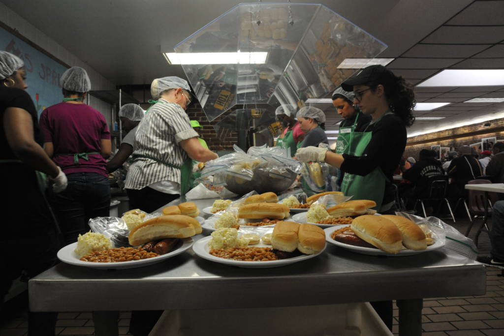 Team Andrews volunteers prepare meals for guests at So Others May Eat in Washington D.C. on May 21, 2013. Service members can find out how to give back to the local community with S.O.M.E. by contacting Chapel One at 301-981-2111
