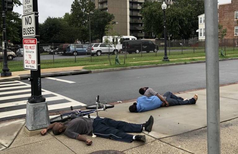 Men passed out on sidewalk