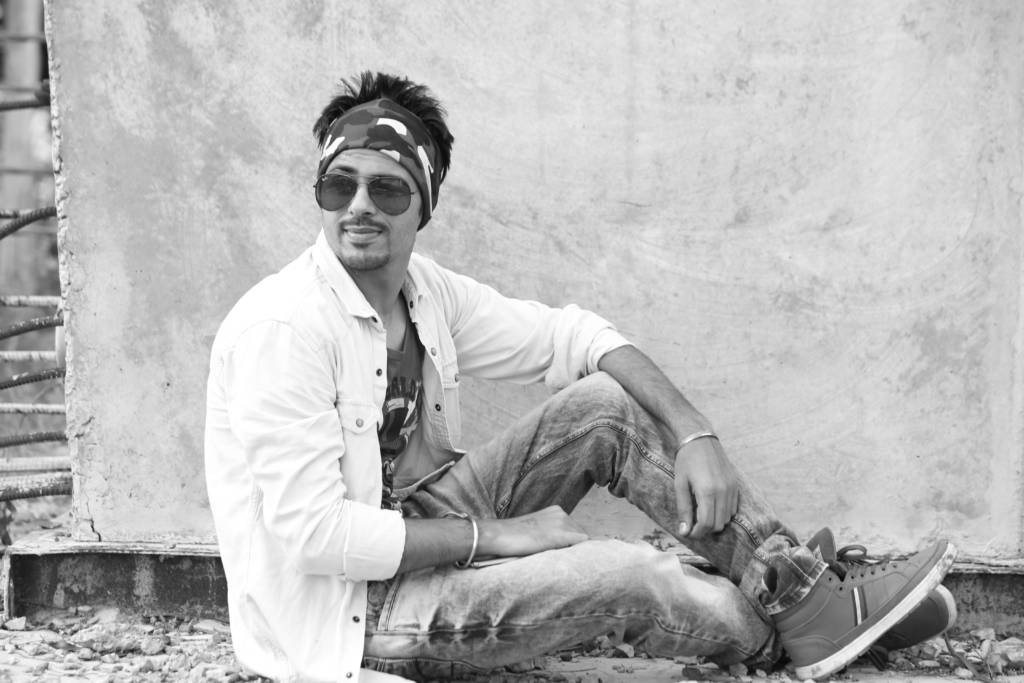 Cool guy lounging on the street.