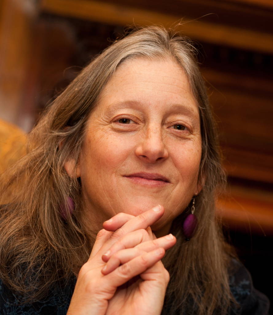 Portrait of Author, Annie Finch with her hands folded