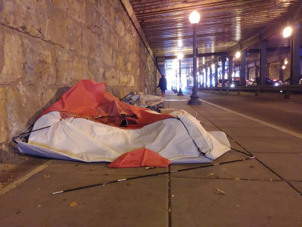 Photo of a collapsed tent in the L Street NE underpass.
