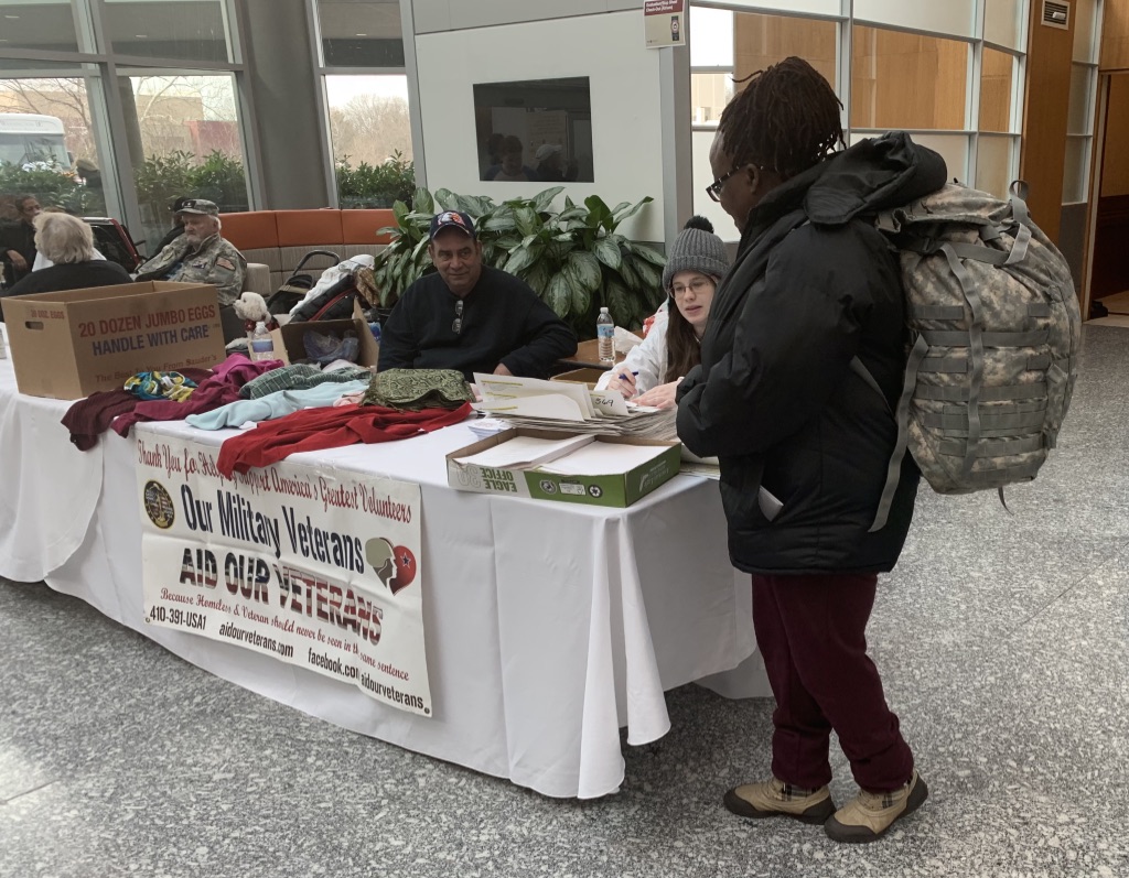 A picture of a woman processing a veteran's checklist at Winterhaven.