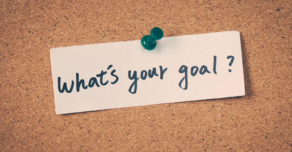 Photo of a note on a bulletin board saying "What's your goal?"