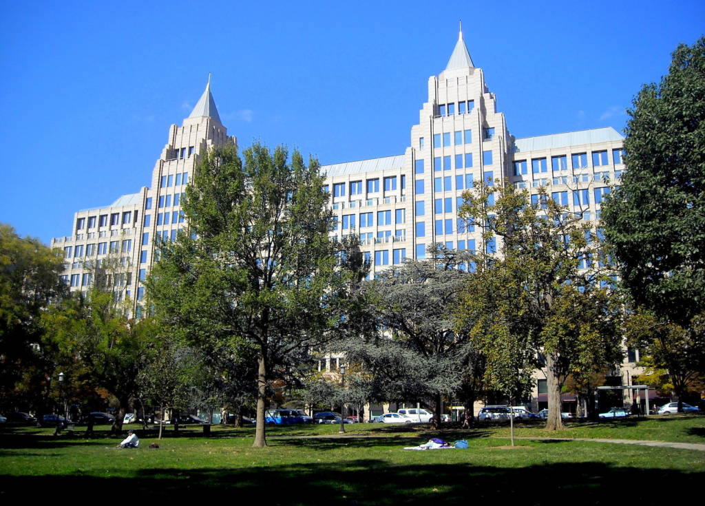Franklin Park green space and trees in front of tall buildings