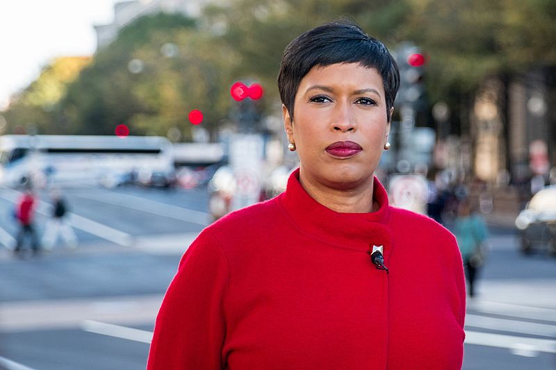 Photo of Mayor Muriel Bowser with street scene in the background.