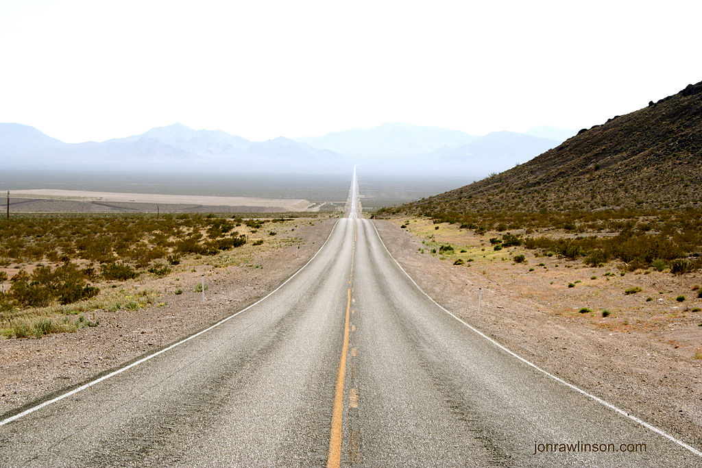 Photo of a long road stretching into the distance.