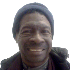 Portrait photo of Tyrone Hall from the shoulders up.