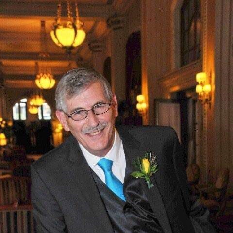 Bob Wallen stands smiling at the camera