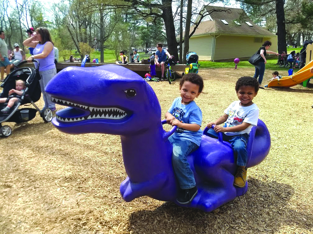 Two boys are on a playground 
