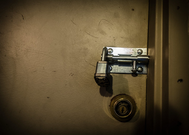 Multiple locks on a door at one of Sanford Capital's former properties.