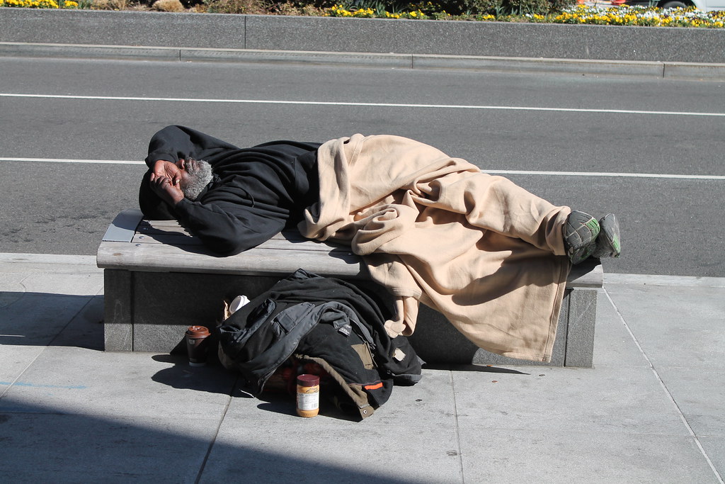 homeless man on a bench