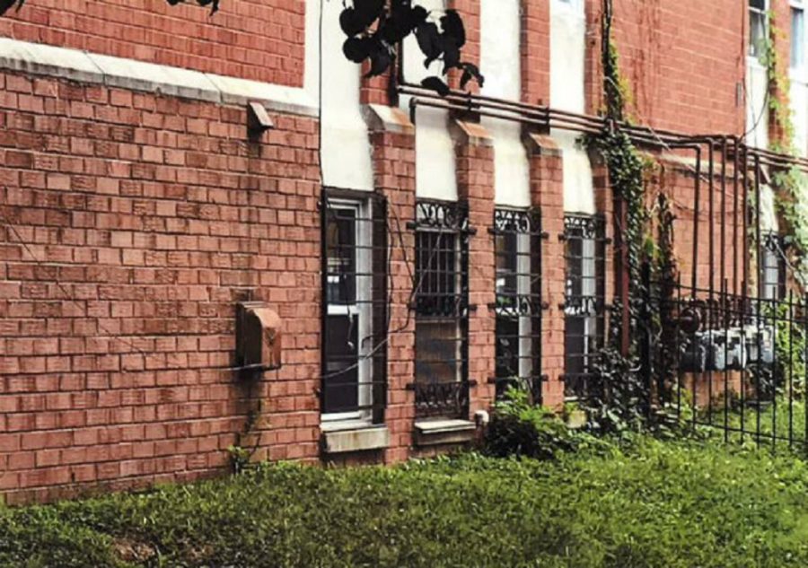 Red brick building with iron bars