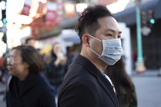 Photo of man wearing a mask