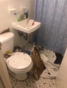 Photo of a fallen-in ceiling in a Rapid Rehousing unit.