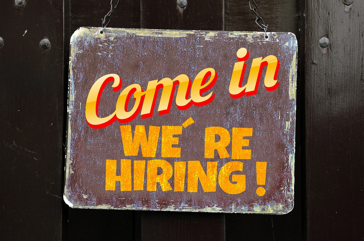 A sign reads "come in, we're hiring."